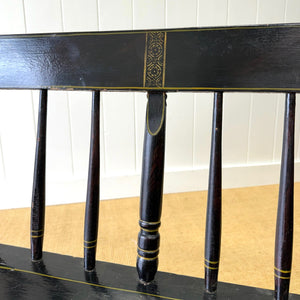 An Antique Ebonized Bench