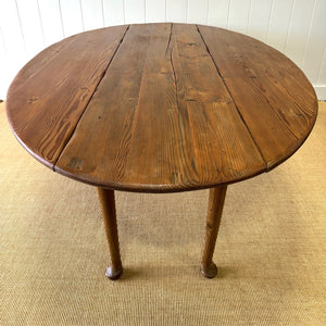 An Antique Irish Pine Oval Drop Leaf Kitchen Dining Table with Spoon Feet