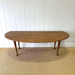 An Antique Irish Pine Oval Drop Leaf Kitchen Dining Table with Spoon Feet