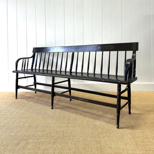 An Antique Ebonized Bench