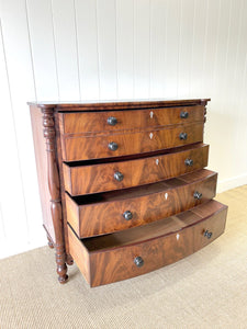 A Large Antique English Bow Front Mahogany Chest of Drawers