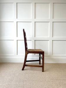 An 18th Century Oak Rush Seated Ladderback Side Chair