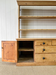 An Early 19th Century Monumental Pine Welsh Dresser or Cupboard