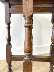 An Antique English Country Oak Coaching Gate Leg Table