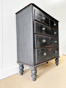 An Ebonized Antique English Chest of Drawers/Dresser