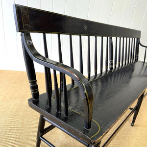 An Antique Ebonized Bench