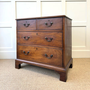 A English Georgian Chest of Drawers with Swan Neck Hardware