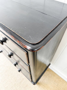 An Ebonized Antique English Chest of Drawers/Dresser