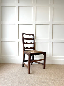 An 18th Century Oak Rush Seated Ladderback Side Chair