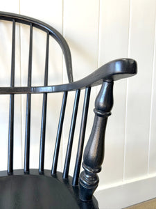 A Set of Four Black Windsor Armchairs