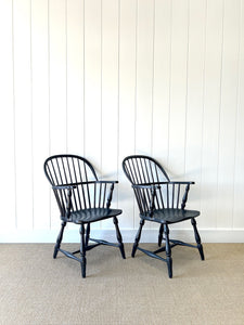 A Set of Four Black Windsor Armchairs