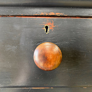 An Ebonized Antique English Chest of Drawers/Dresser