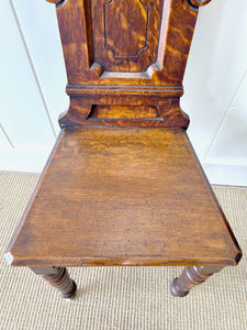 A Pair of English Oak Carved Hall Chairs