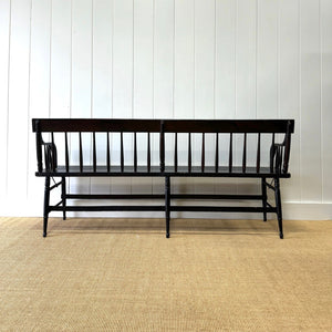 An Antique Ebonized Bench