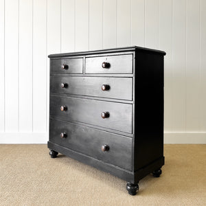 An Ebonized Antique English Chest of Drawers/Dresser