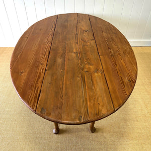 An Antique Irish Pine Oval Drop Leaf Kitchen Dining Table with Spoon Feet