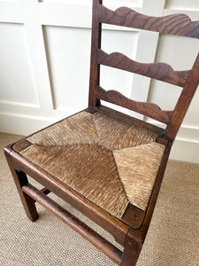 An 18th Century Oak Rush Seated Ladderback Side Chair