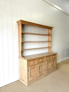 An Early 19th Century Monumental Pine Welsh Dresser or Cupboard