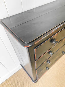 An Ebonized Antique English Chest of Drawers/Dresser