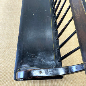 An Antique Ebonized Bench