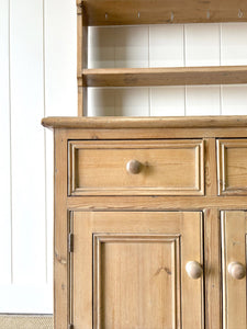 An Early 19th Century Monumental Pine Welsh Dresser or Cupboard