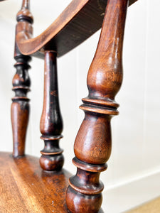 An Antique Penny-seat Stick Back Arm Chair