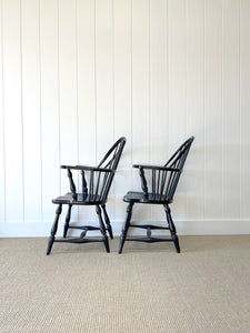 A Set of Four Black Windsor Armchairs