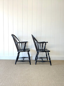 A Set of Four Black Windsor Armchairs