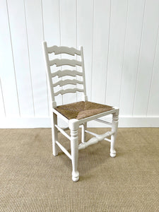 A Set of 4 Ladderback Rush Seat Chairs Painted White