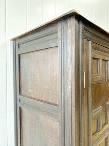 An Antique English William III Oak Clothes Cupboard