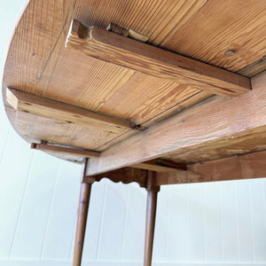 An Antique Irish Pine Oval Drop Leaf Kitchen Dining Table with Spoon Feet