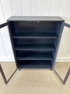 A Pair of English Teak Ebonized Bookcases