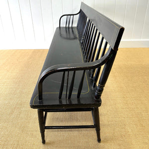 An Antique Ebonized Bench