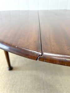 An Antique Cuban Mahogany Drop Leaf Dining Table with Pad Feet