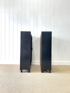 A Pair of English Teak Ebonized Bookcases