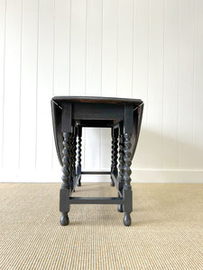 An Antique English Ebonized Country Oak Drop Leaf Gate Leg Table