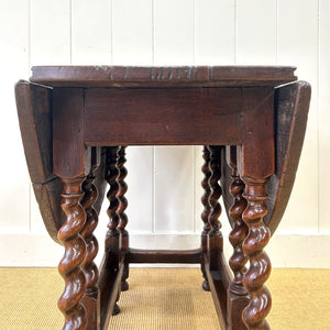 An Antique English Country Barley Twist Oak Drop Leaf Gate Leg Table