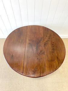 An Antique Cuban Mahogany Drop Leaf Dining Table with Pad Feet