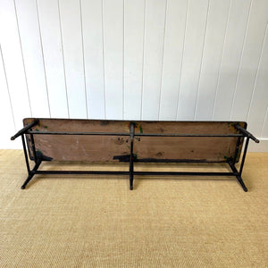 An Antique Ebonized Bench