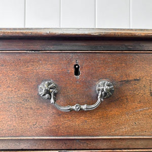 A English Georgian Chest of Drawers with Swan Neck Hardware