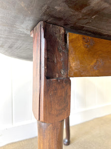 An Antique Cuban Mahogany Drop Leaf Dining Table with Pad Feet