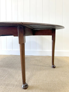 An Antique Cuban Mahogany Drop Leaf Dining Table with Pad Feet