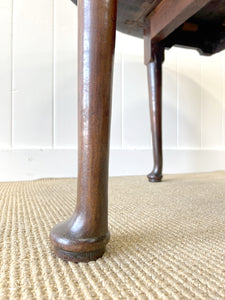 An Antique Cuban Mahogany Drop Leaf Dining Table with Pad Feet