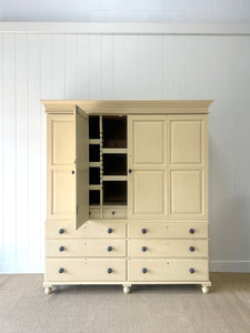 A Very Large and Useful English Pine Painted Housekeepers Cupboard