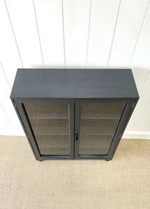 A Pair of English Teak Ebonized Bookcases