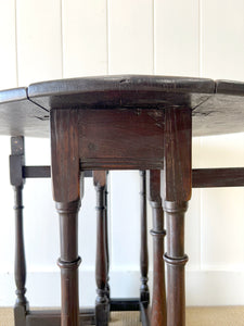 A Petite Antique English Country Oak Drop Leaf Gate Leg Table