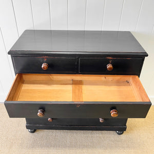 An Ebonized Antique English Chest of Drawers/Dresser