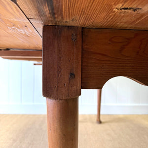 An Antique Irish Pine Oval Drop Leaf Kitchen Dining Table with Spoon Feet