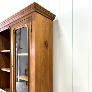 A 19th Century English Pine Bookcase Cabinet or Hutch with Arched Doors