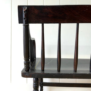 An Antique Ebonized Bench